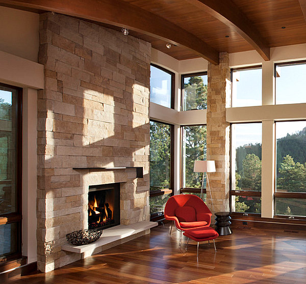 Light stone fireplace with a bright chair