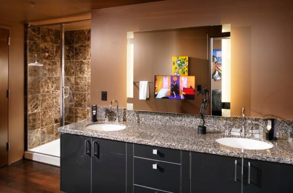 Mirrors with side lighting and sober tones give this masterbath a dark look