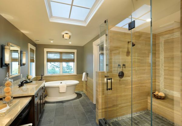 Modern bathroom in yellow and gray with spacious glass shower area