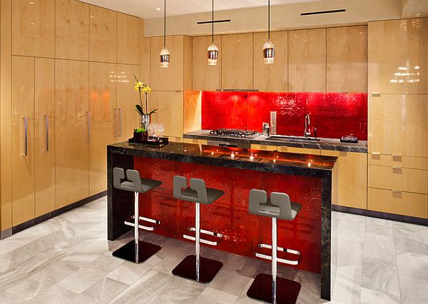 Modern kitchen with red accent backsplash and island