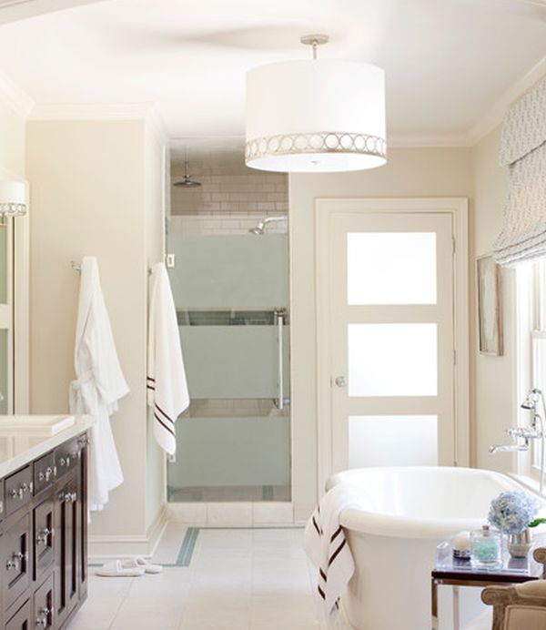 Pristine white bath with gorgeous framed glass shower door