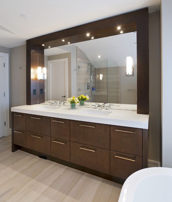 Sleek and stylish modern bathroom vanity sparkles thanks to well placed lighting