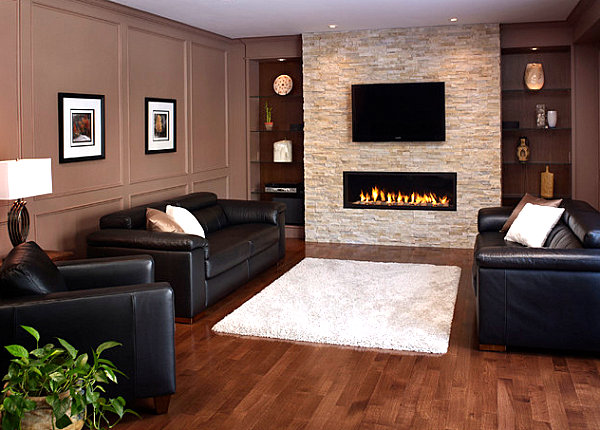 Stone fireplace with TV overhead