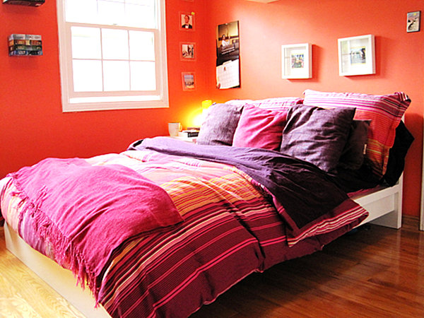 Tangerine bedroom with purple bedding