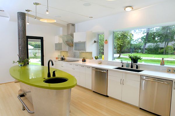 Bright colored kitchen with a modern design and green tones