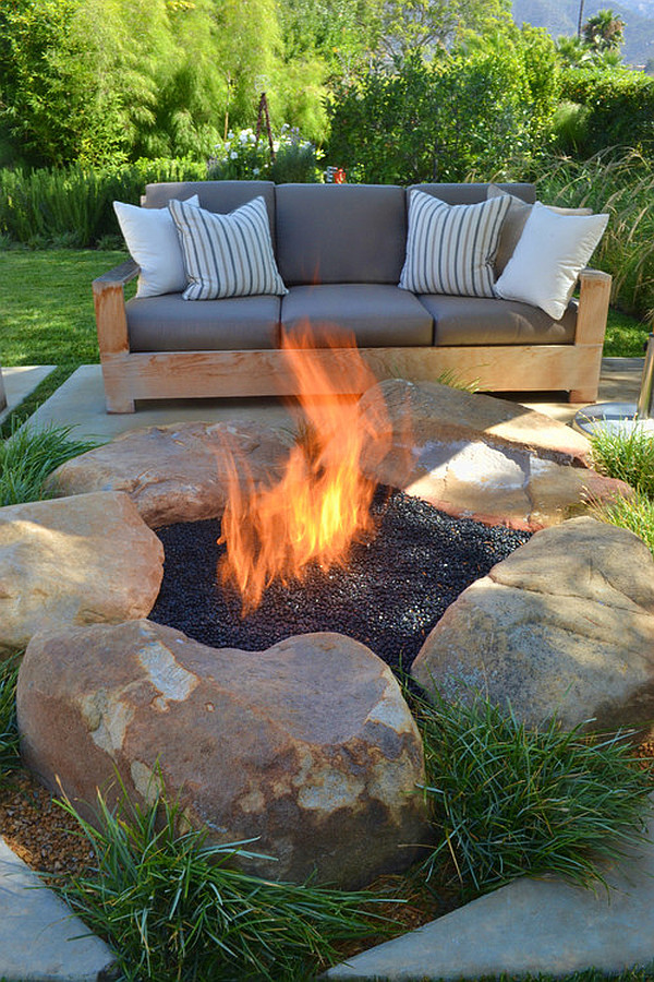 contemporary patio with rustic firepit