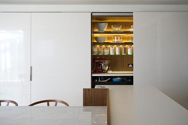 kitchen storage concealed behind sliding doors