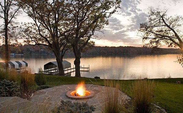 lake house with an outdoor patio and firepit