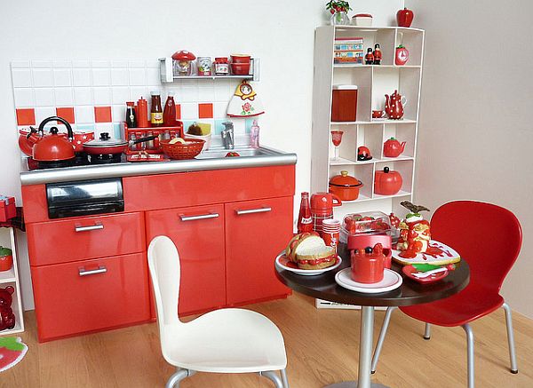 small apartment kitchen in red and white