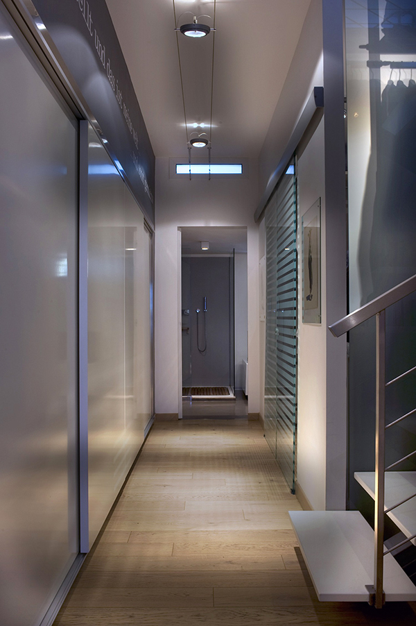 ultra modern hallway with bathroom at the end