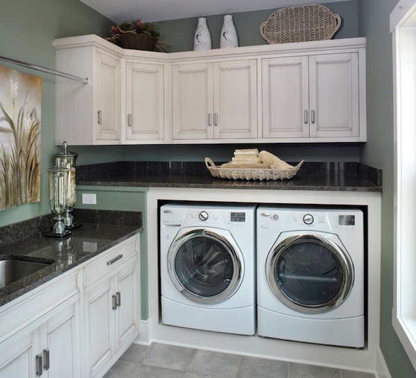 white washed cabinetry laundry room