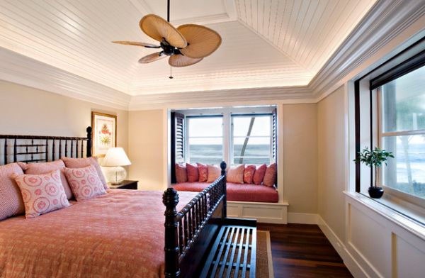 Classic tray ceiling design uses an artistic fan to accentuate the beauty of this bedroom