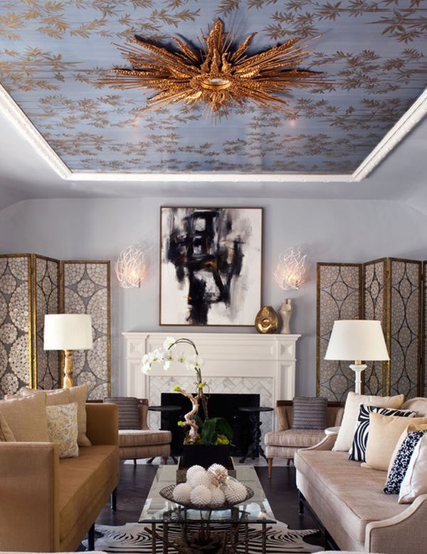 Gold-leafed starburst mirror on the ceiling steals the show in this royally styled study