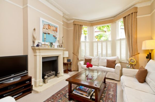 Half shutters and beautiful blinds offer a lovely look to this room