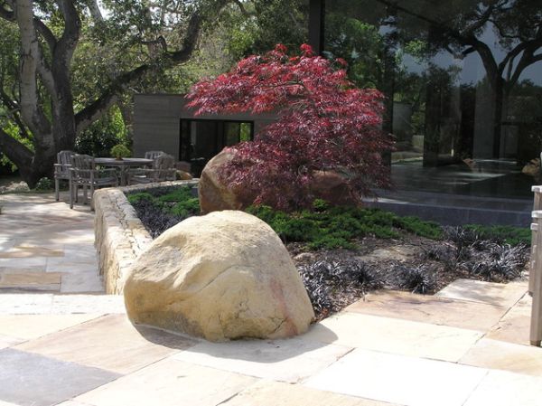 Simple garden space with a fine balance of rock, stone and a touch of Japanese maple