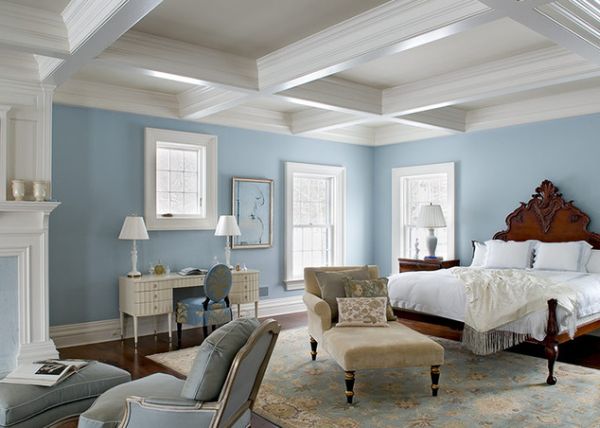 Stylish light ceiling, cool blue walls and dark flooring offer lovely contrast to this weekend getaway bedroom