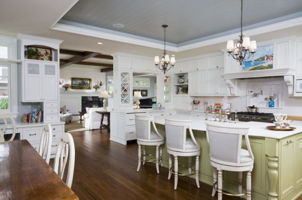 Varied ceiling and ergonomic lighting add beauty to this lovely East Coast style kitchen