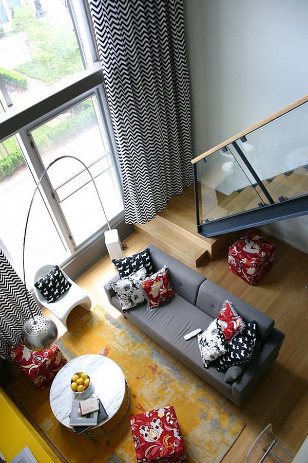 loft apartment with long black and white curtains