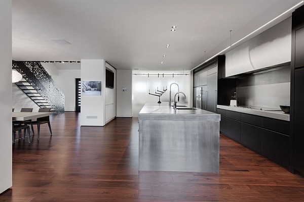 stainless kitchen island and black kitchen cabinets