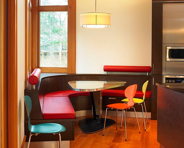 Triangular kitchen table with colorful chairs