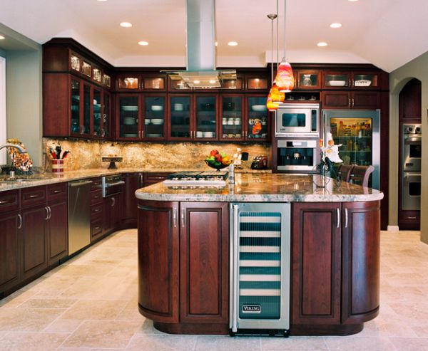 Beautiful cherrywood cabinets complement the glass door refrigerator perfectly