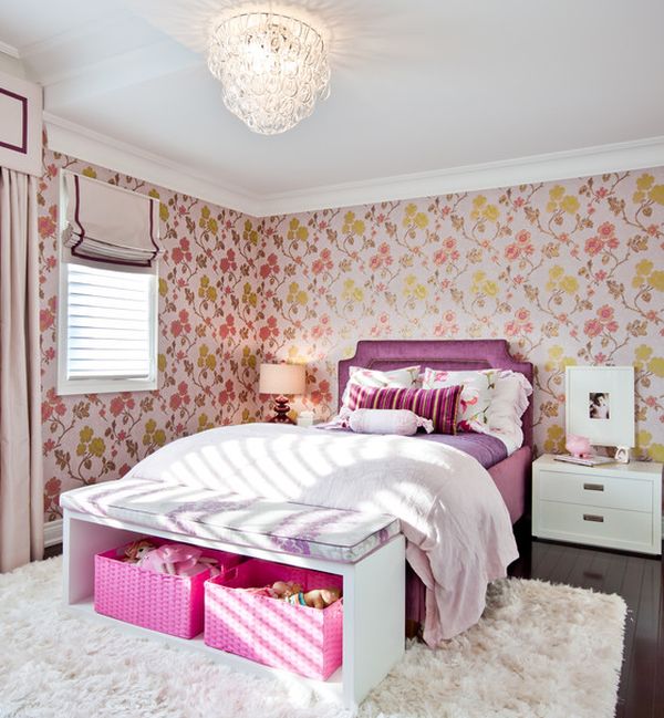 Chic girls' bedroom in pink with a beautiful bench that hides pink storage baskets with ease