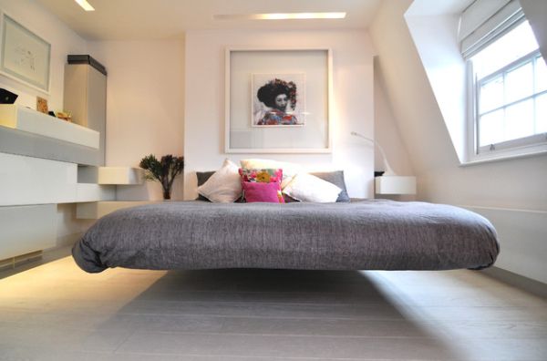 Chic modern bedroom with a cool floating bed draped in gray