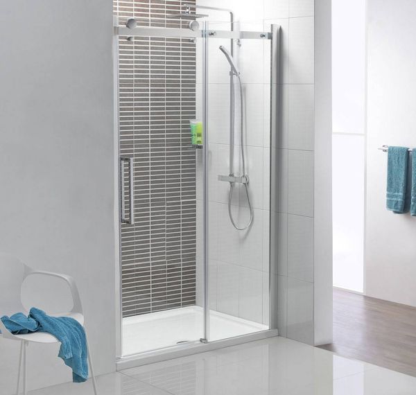 Compact shower space with a polished chrome frame and clear glass shower door