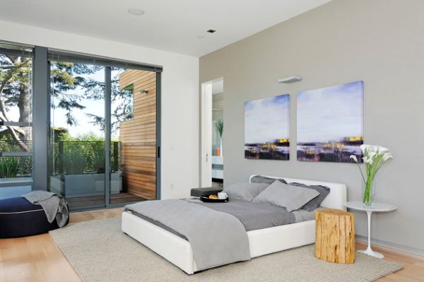 Contemporary bedroom in neutral tones sports sliding glass doors