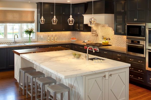 Delicate Eureka Snowlab glass pendant lights above a marble counter