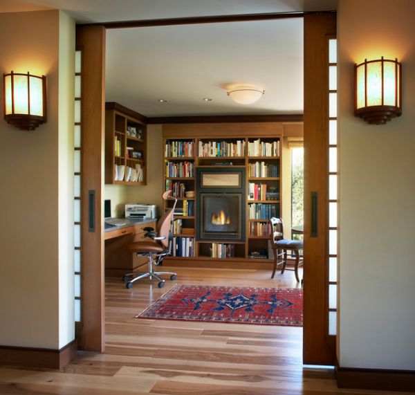 Elaborate home office with sliding glass doors that tuck away into the wall