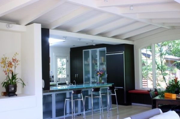 Elegant modern kitchen with glass door refrigerator next to beautiful Wenge cabinets