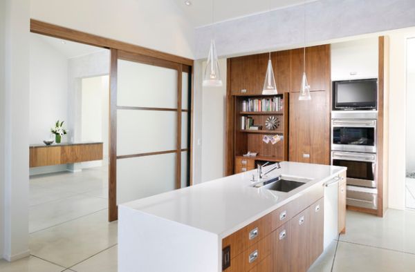 Ergonomic and organized contemporary kitchen with translucent sliding doors