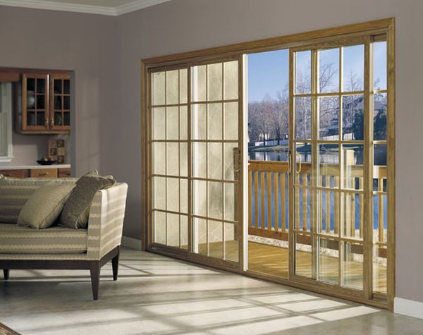 Four Panel sliding glass door in with sqaure grids creates a timeless look