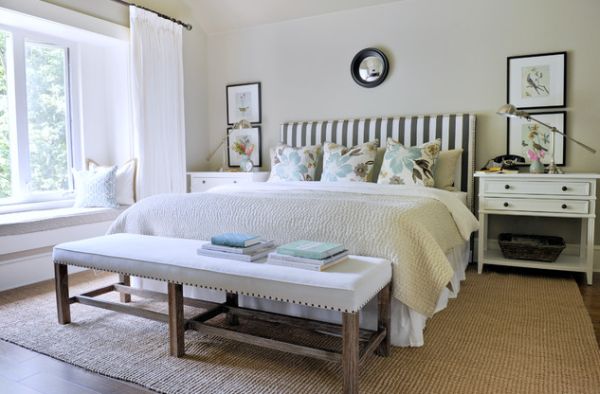 Fresh and peaceful modern bedroom with furnishings largely clad in white