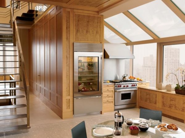 Glass door refrigerator with an air purifier adds a unique textural element to this home