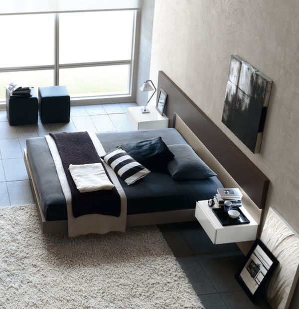 Gorgeous modern bedroom in black and white with beautiful floating bed