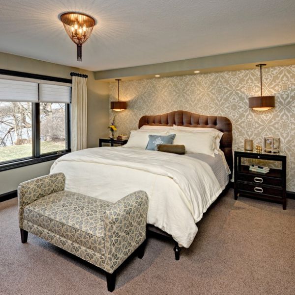 Master bedroom with a king-sized bed and a bench with fun pattern