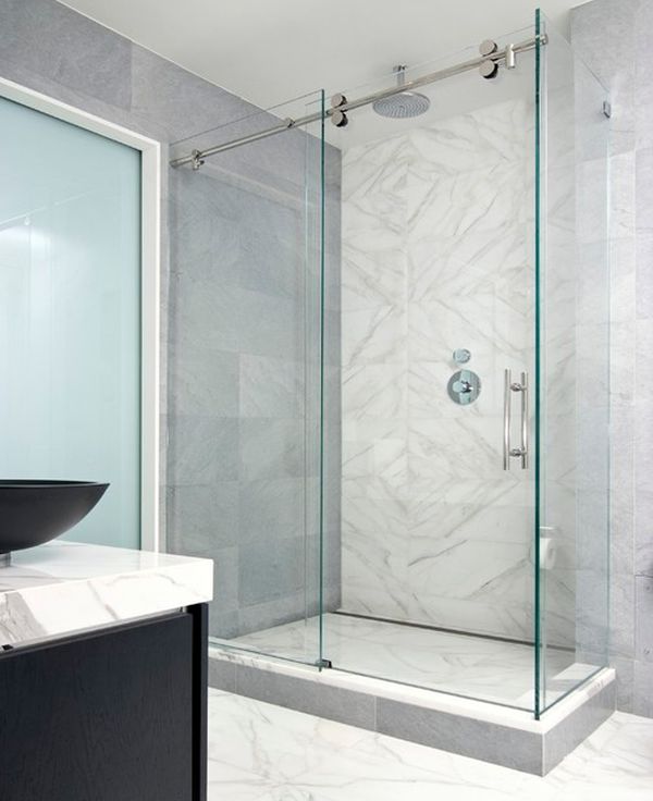 Modern minimalist shower enclosure encased in glass