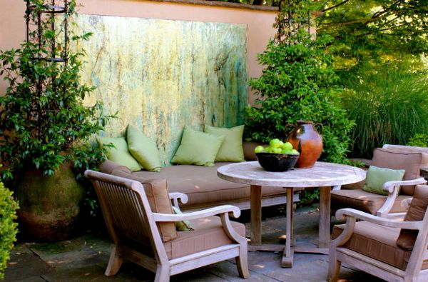 Seating area in colors that blend well with green makes for a useful art installation