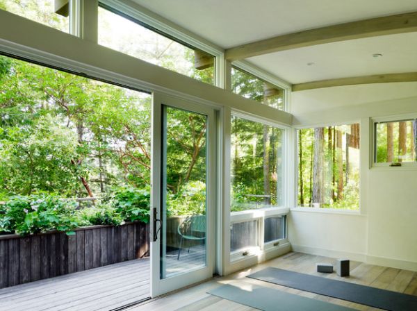 Sliding glass doors providing views of sunrise and the trees