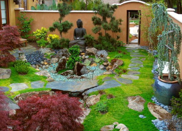 Statue of Buddha surrounded by some colorful canopy