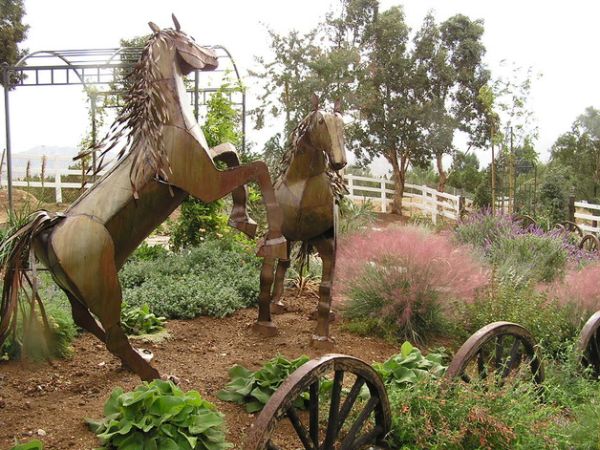 Stunning horse sculptures make a fascinating addition to this distinctive garden