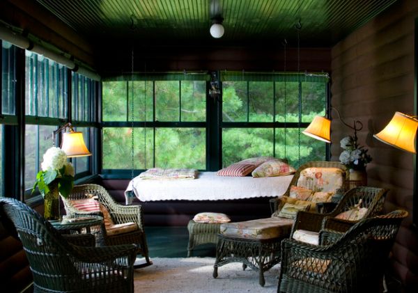 Stunning screened porch with a hanging bed offering the best seat in the house