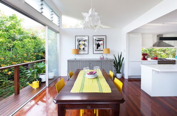 Stylish dining area with sliding glass doors providing access to a small balcony