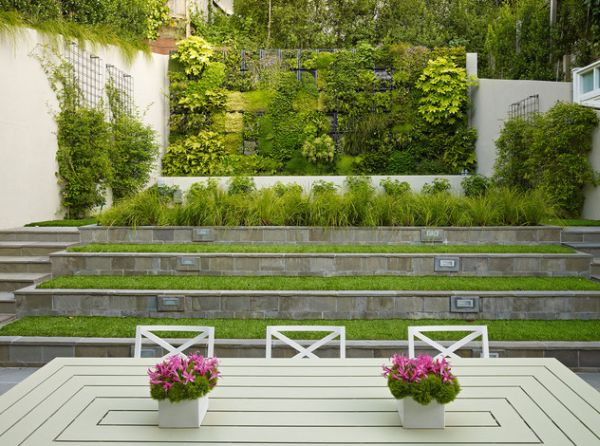 Terraced planters and a living wall make for fine garden art installations in an urban setting