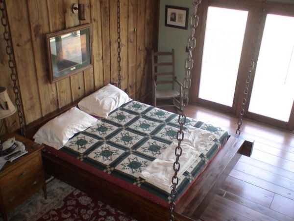 Timber frame hanging bed for the rustic look