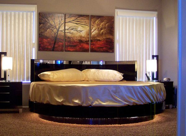 Vivacious bedroom with a flashy circle bed at its center