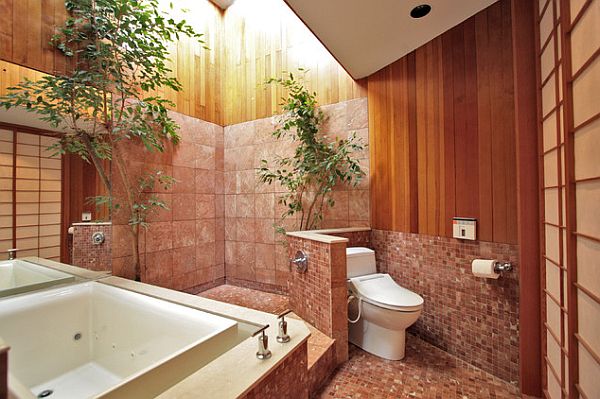 bathroom with an privacy wall for the toilet