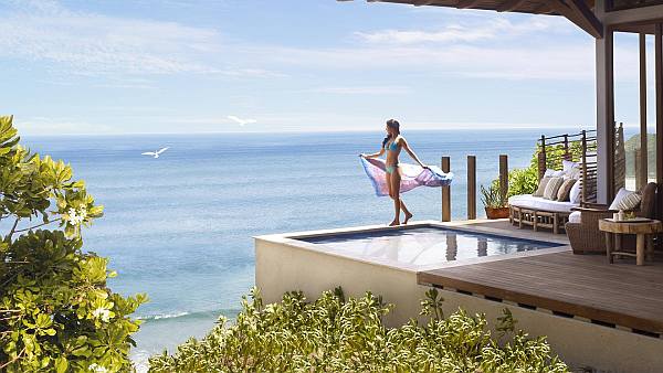 bedroom with private spa and ocean views